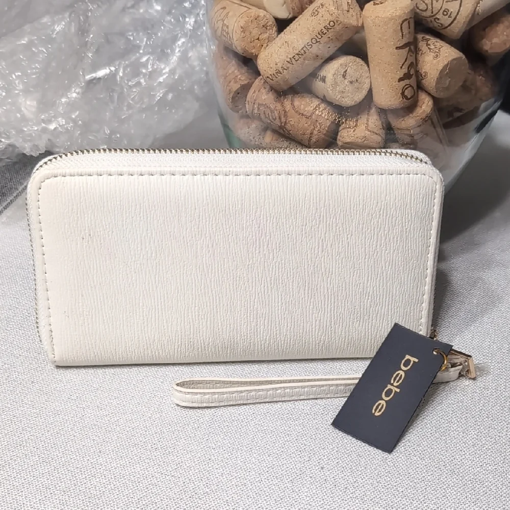 bebe White Zip Wristlet Clutch with Gold Logo